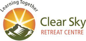 Clear Sky Retreat Center Logo as of 2018 - sun rising behind mountain.