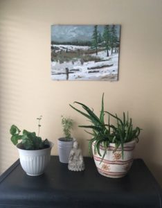 plants and picture in living room