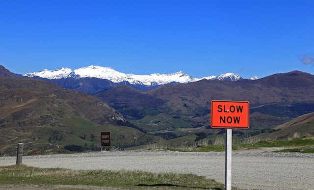 slow now sign on mountain pass