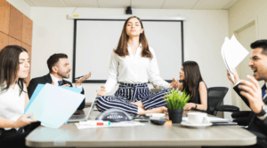 woman meditating on desk