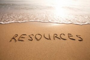 The word resources written in sand