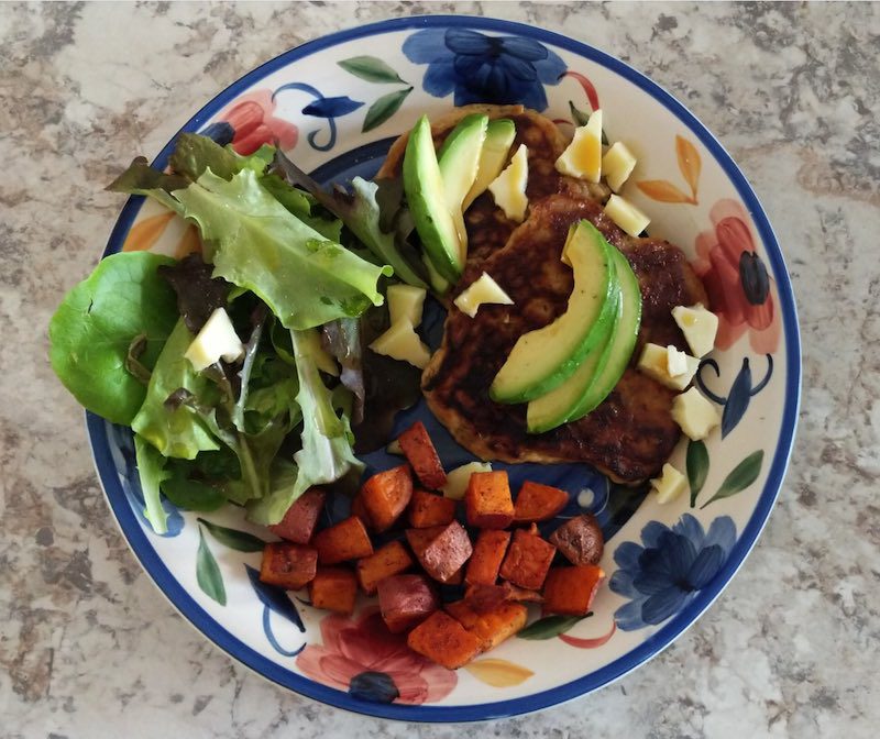 a plate of food including avocado
