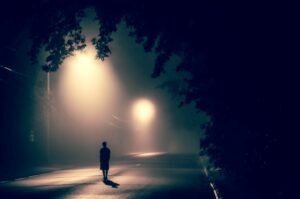 Lonely walk in street at night